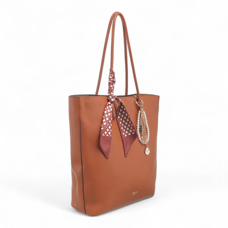 Bag Shack tan faux leather tote bag with zip top, removable patterned scarf, and decorative pearl charm