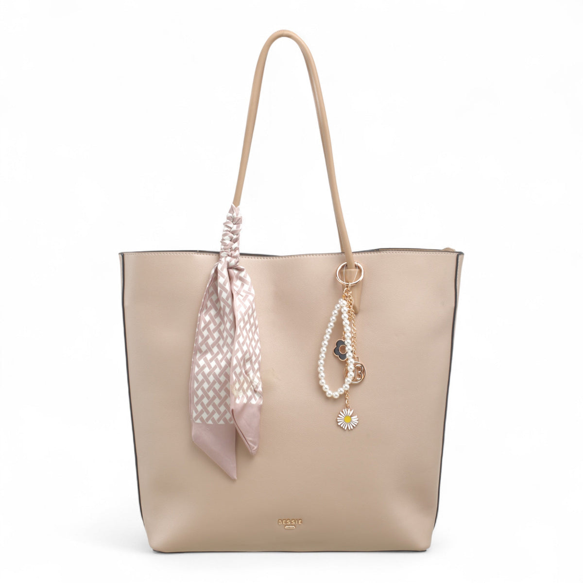 Bag Shack Bessie taupe faux leather tote bag with a decorative patterned scarf, pearl charm, and zip-top closure.