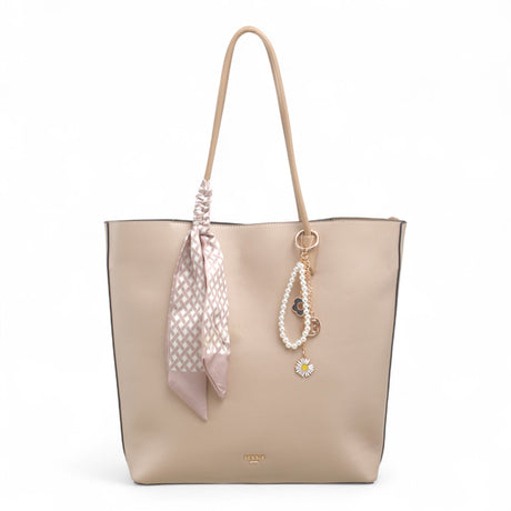 Bag Shack Bessie taupe faux leather tote bag with a decorative patterned scarf, pearl charm, and zip-top closure.